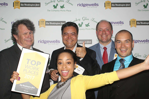 Five TCG staff celebrate a Washington Post Top Workplace award.