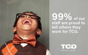 Boy laughing. Text reads: 99% of our staff are proud to tell others they work for TCG.