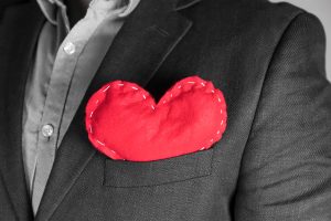 Handmade plush heart inserted in a blazer pocket.