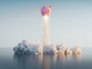 Piggy bank launching similar to a rocket.